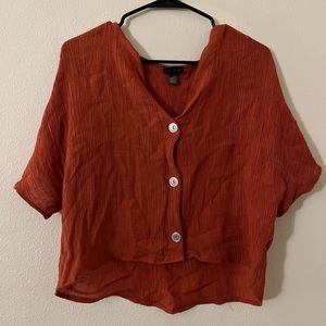 Cute orange crop topped with texture.